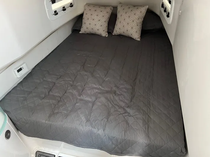 Perseverance Yacht Photos Pics Cozy cabin bed in 2019 Fountain 39 NX boat with gray bedding and pillows.