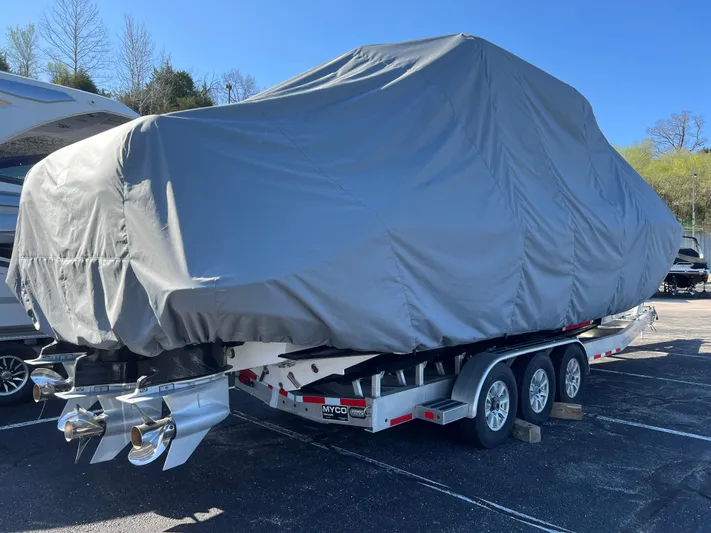 Perseverance Yacht Photos Pics Covered 2019 Fountain 39 NX boat on trailer, parked outdoors under clear sky.