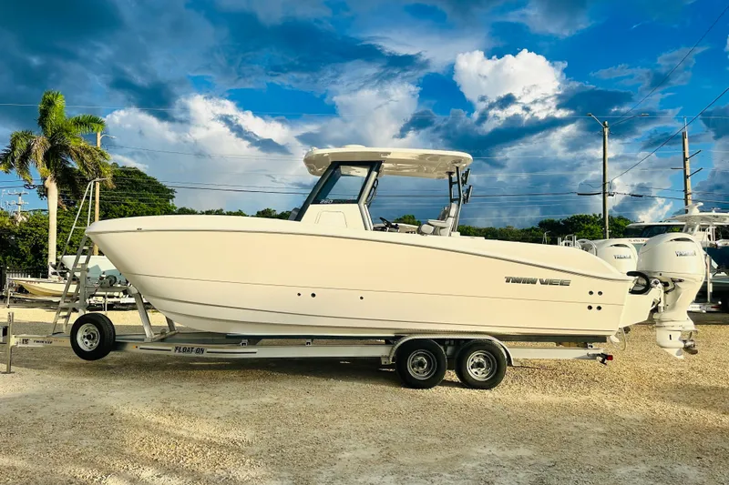  Yacht Photos Pics 2025 Twin Vee 260 GFX2 CC boat on trailer under a vibrant sky.