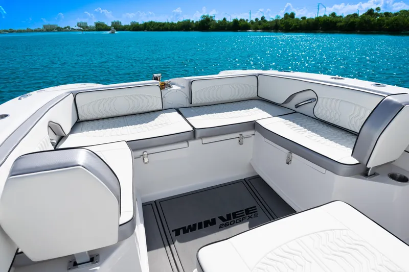  Yacht Photos Pics Luxurious seating on 2025 Twin Vee 260 GFX2 CC boat, with scenic water view.