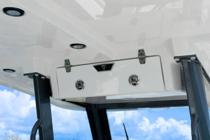  Yacht Photos Pics 2025 Twin Vee 260 GFX2 CC boat storage compartment with sleek design and sturdy hinges.