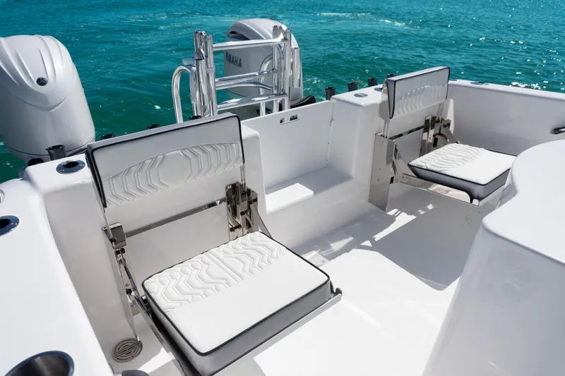  Yacht Photos Pics 2025 Twin Vee 260 GFX2 CC boat interior with foldable seats and Yamaha engines.