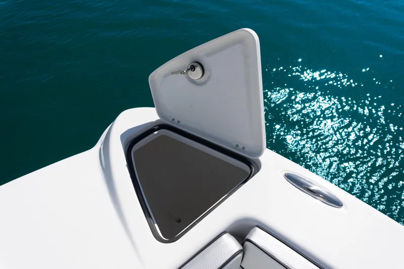  Yacht Photos Pics 2025 Twin Vee 260 GFX2 CC boat hatch open on sparkling blue water.