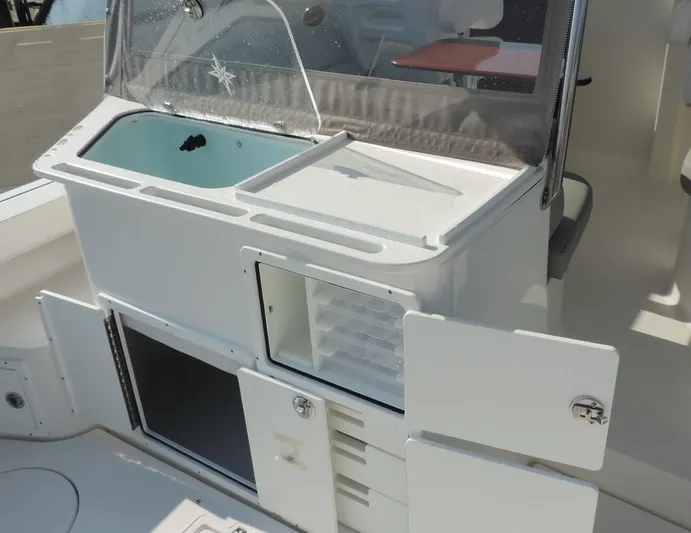  Yacht Photos Pics 2024 NorthCoast 285HT boat interior with storage compartments and sink.