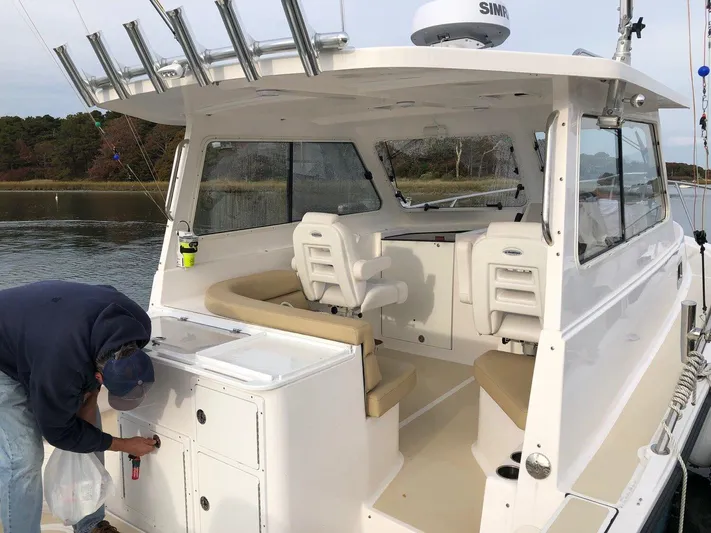  Yacht Photos Pics 2024 NorthCoast 285HT boat with spacious seating and fishing rod holders.