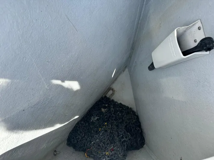 C'est Bon Yacht Photos Pics Storage compartment on a 2005 Beneteau Swift Trawler 42 with rope and holder.