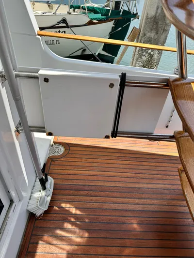 C'est Bon Yacht Photos Pics 2005 Beneteau Swift Trawler 42 deck with wooden flooring and stairs.