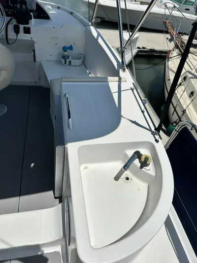 C'est Bon Yacht Photos Pics 2005 Beneteau Swift Trawler 42 deck with sink and seating area.