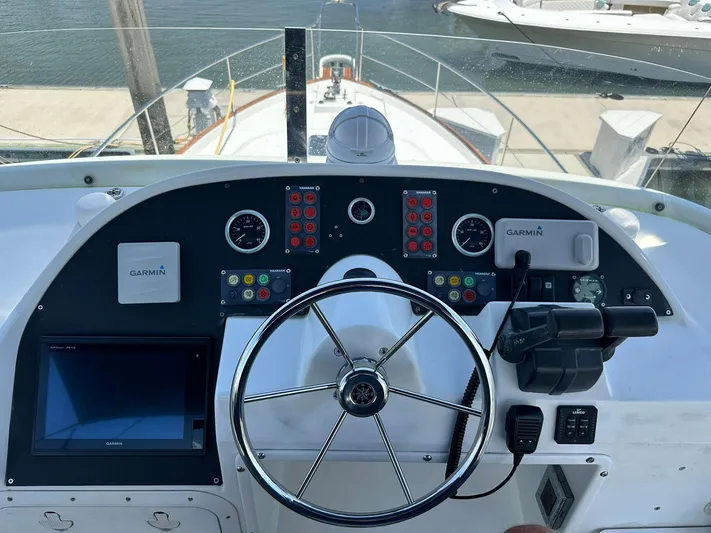 C'est Bon Yacht Photos Pics Helm of 2005 Beneteau Swift Trawler 42 with Garmin navigation system and steering wheel.