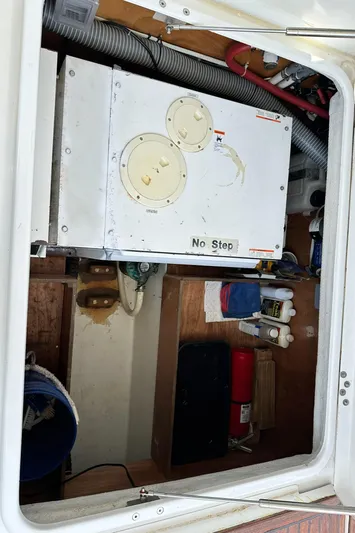 C'est Bon Yacht Photos Pics Engine compartment of 2005 Beneteau Swift Trawler 42 with storage and equipment.