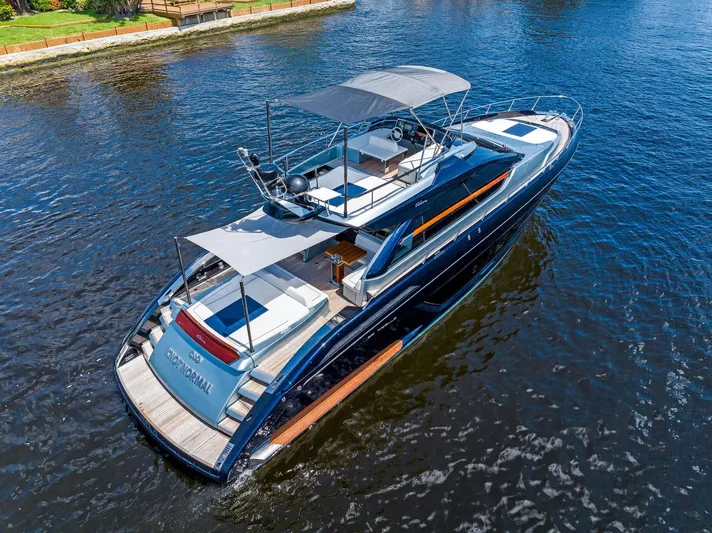 Knot Normal Yacht Photos Pics 2020 Riva 66' Ribelle luxury yacht cruising on a calm river.