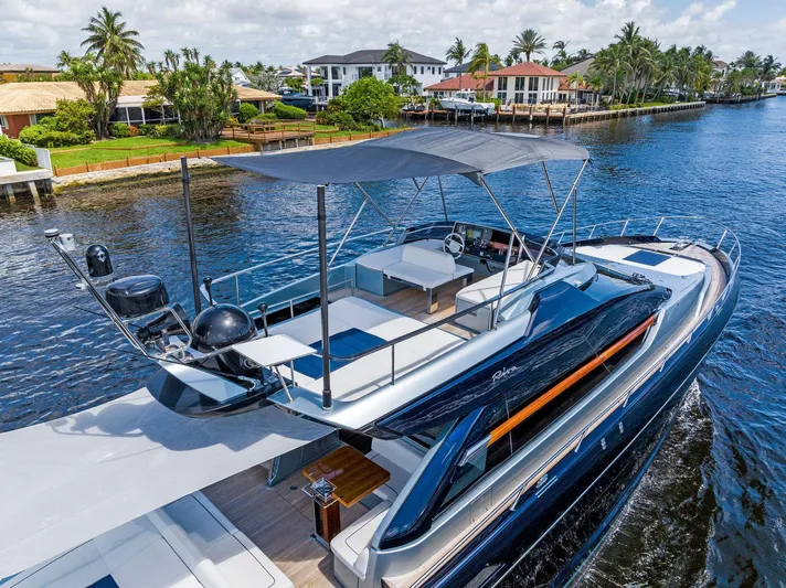 Knot Normal Yacht Photos Pics 2020 Riva 66' Ribelle luxury yacht cruising near waterfront homes.