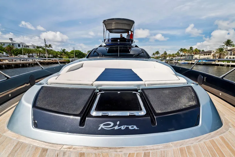 Knot Normal Yacht Photos Pics 2020 Riva 66' Ribelle luxury yacht docked in a marina.