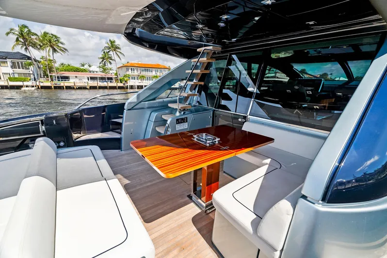 Knot Normal Yacht Photos Pics Luxurious 2020 Riva 66' Ribelle yacht with elegant outdoor seating and dining area.