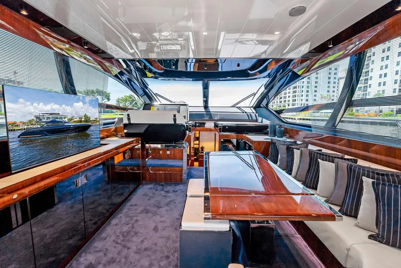 Knot Normal Yacht Photos Pics Luxurious interior of a 2020 Riva 66' Ribelle yacht with modern furnishings and large windows.