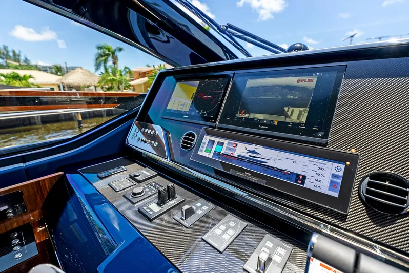 Knot Normal Yacht Photos Pics Control panel of a 2020 Riva 66' Ribelle yacht with advanced navigation systems.