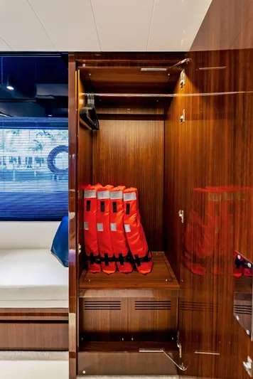 Knot Normal Yacht Photos Pics Wooden closet with life jackets on a 2020 Riva 66' Ribelle yacht.