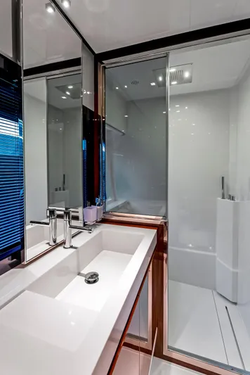 Knot Normal Yacht Photos Pics Modern bathroom in 2020 Riva 66' Ribelle yacht with sleek fixtures and glass shower.