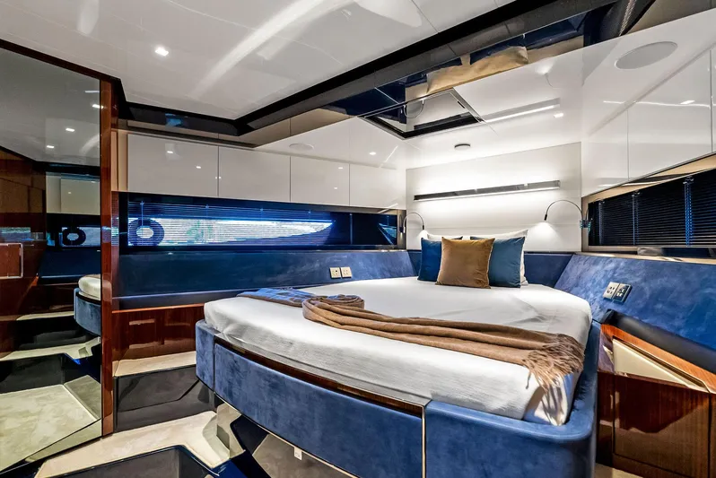 Knot Normal Yacht Photos Pics Luxurious bedroom interior of 2020 Riva 66' Ribelle yacht with modern design and elegant furnishings.