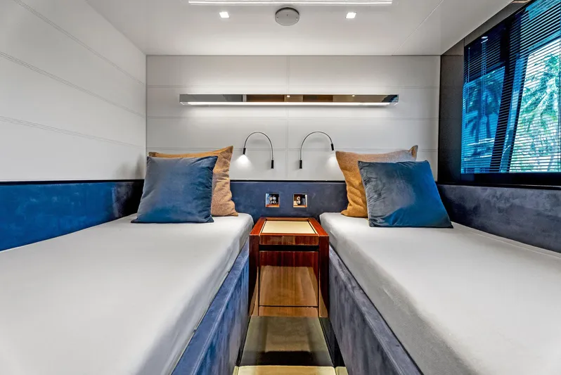 Knot Normal Yacht Photos Pics Modern twin cabin interior of 2020 Riva 66' Ribelle yacht with sleek design.