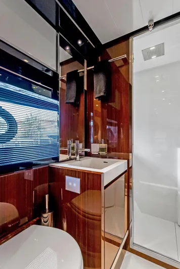 Knot Normal Yacht Photos Pics Luxurious bathroom in 2020 Riva 66' Ribelle yacht with modern fixtures and sleek design.