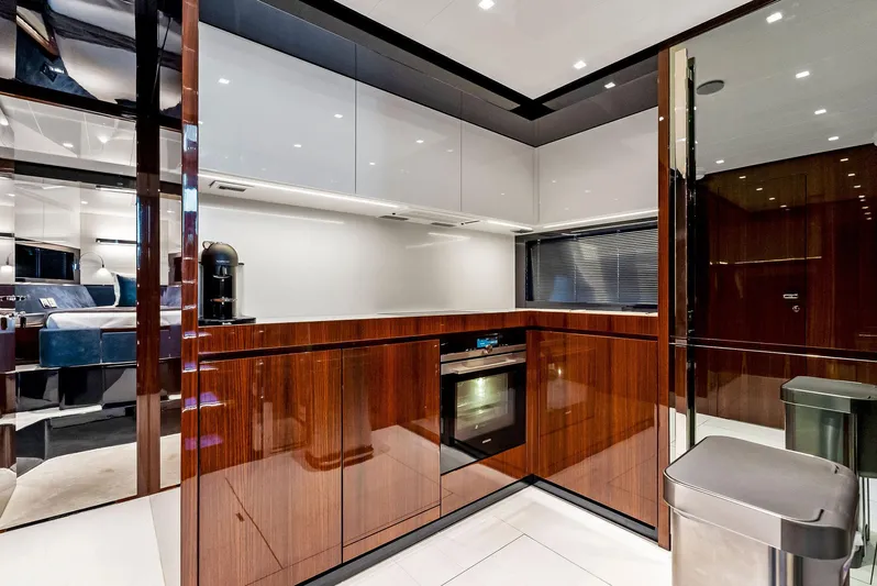 Knot Normal Yacht Photos Pics Modern kitchen interior on a 2020 Riva 66' Ribelle yacht with sleek cabinetry.