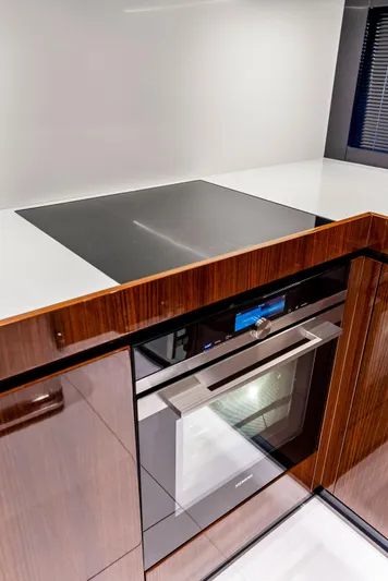 Knot Normal Yacht Photos Pics Modern kitchen area in 2020 Riva 66' Ribelle yacht with sleek appliances.