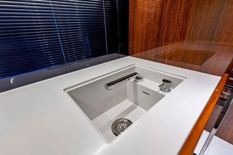 Knot Normal Yacht Photos Pics Modern kitchen sink in 2020 Riva 66' Ribelle yacht with sleek design and wooden accents.