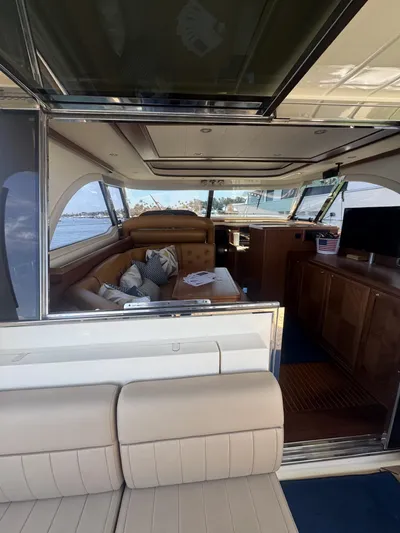 True Story Yacht Photos Pics Interior view of 2006 Mochi Craft 51' Dolphin yacht, featuring luxurious seating and elegant design.