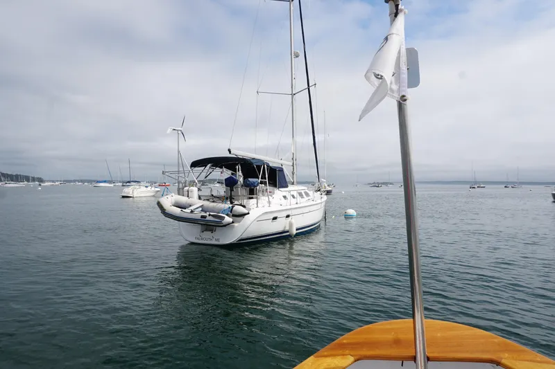  Yacht Photos Pics 2006 Hunter 41 Deck Salon sailboat anchored in a calm harbor.