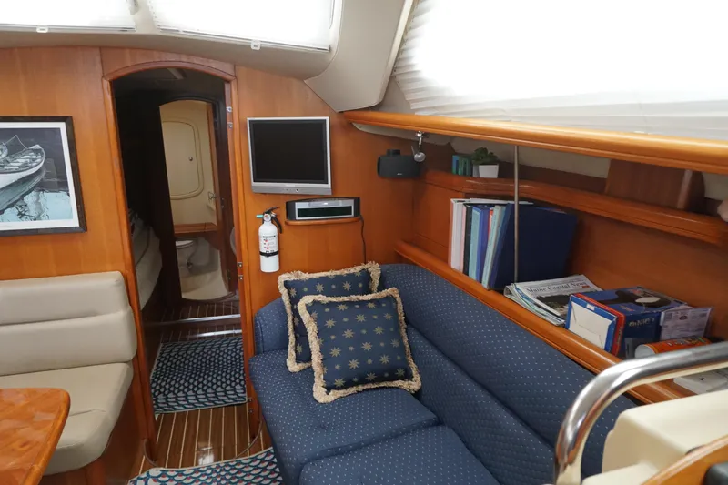  Yacht Photos Pics Interior of 2006 Hunter 41 Deck Salon with cozy seating and nautical decor.