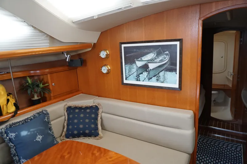  Yacht Photos Pics Interior of 2006 Hunter 41 Deck Salon with cozy seating and nautical decor.