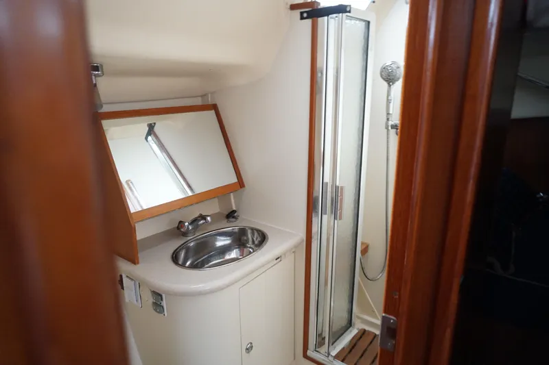  Yacht Photos Pics Bathroom interior of 2006 Hunter 41 Deck Salon with sink and shower.
