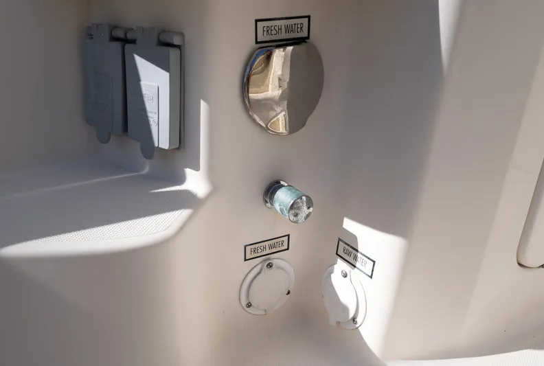 "nameless" Yacht Photos Pics 2014 Pursuit SC 365i Sport Coupe water connections: fresh and raw water access points.