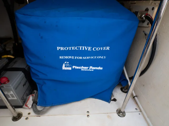 "nameless" Yacht Photos Pics Blue protective cover on generator in 2014 Pursuit SC 365i Sport Coupe.