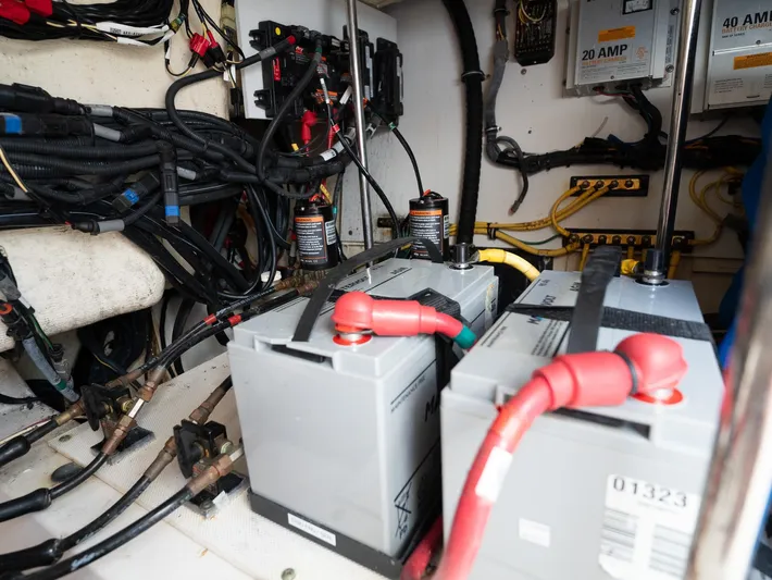 "nameless" Yacht Photos Pics Electrical system of a 2014 Pursuit SC 365i Sport Coupe with batteries and wiring.