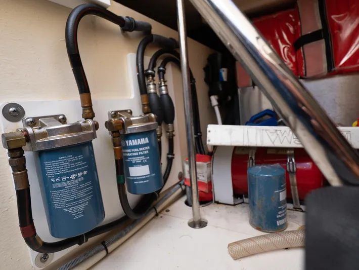 "nameless" Yacht Photos Pics Engine compartment of 2014 Pursuit SC 365i Sport Coupe with Yamaha fuel filters.