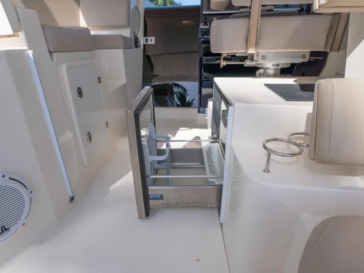 "nameless" Yacht Photos Pics 2014 Pursuit SC 365i Sport Coupe interior with open storage and seating.