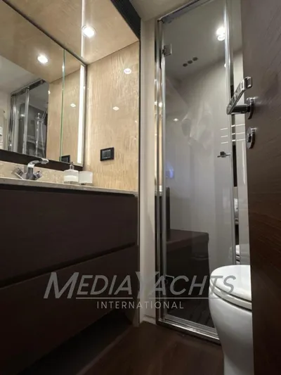  Yacht Photos Pics Luxurious bathroom interior of 2019 Azimut Fly 72 yacht with modern fixtures.