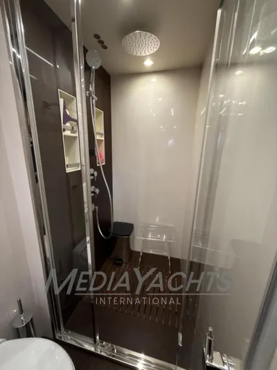  Yacht Photos Pics Luxurious shower in 2019 Azimut Fly 72 yacht with modern fixtures and glass doors.