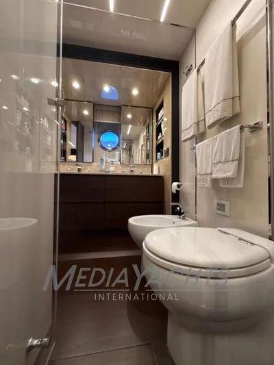  Yacht Photos Pics Luxurious bathroom in 2019 Azimut Fly 72 yacht with modern fixtures and elegant design.