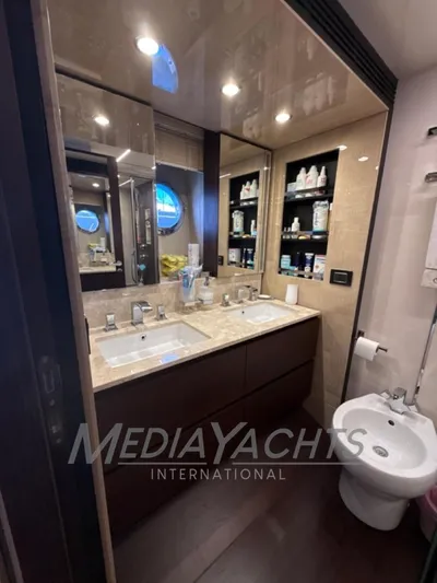  Yacht Photos Pics Luxurious bathroom in 2019 Azimut Fly 72 yacht with dual sinks and modern fixtures.