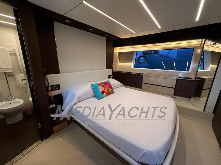  Yacht Photos Pics Luxurious bedroom interior of 2019 Azimut Fly 72 yacht with modern design and large window.