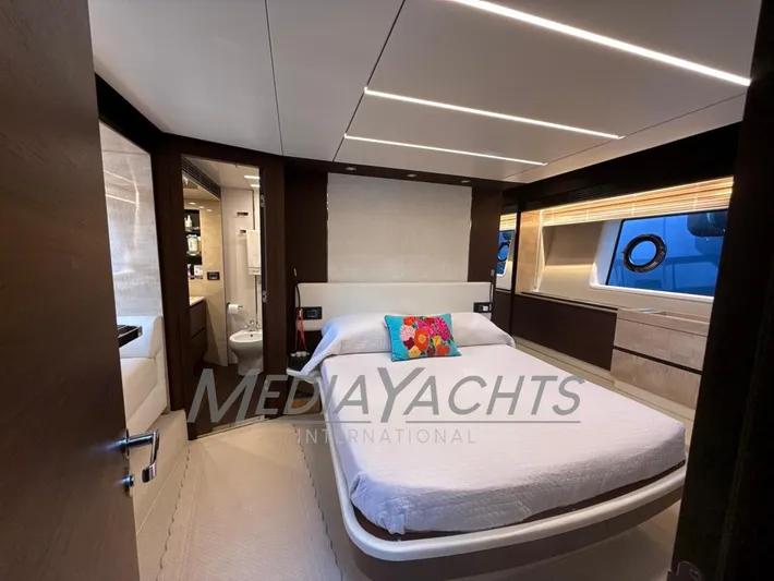  Yacht Photos Pics Luxurious bedroom interior of 2019 Azimut Fly 72 yacht with modern design and vibrant decor.