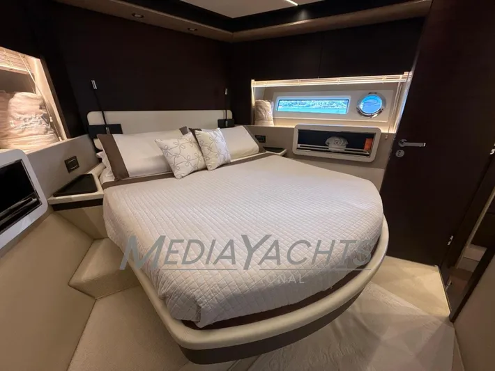  Yacht Photos Pics Luxurious bedroom interior of 2019 Azimut Fly 72 yacht with modern design and cozy bedding.