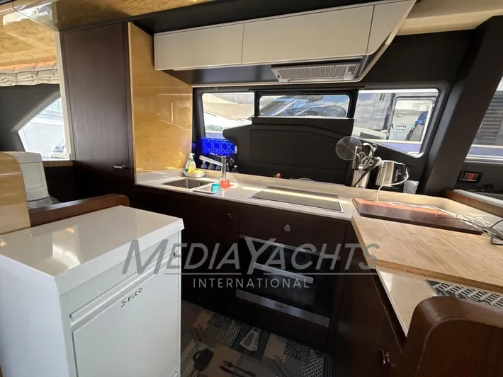 Yacht Photos Pics Luxurious kitchen interior of 2019 Azimut Fly 72 yacht with modern amenities.