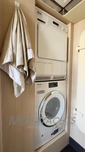  Yacht Photos Pics Laundry area with Miele appliances on 2019 Azimut Fly 72 yacht.