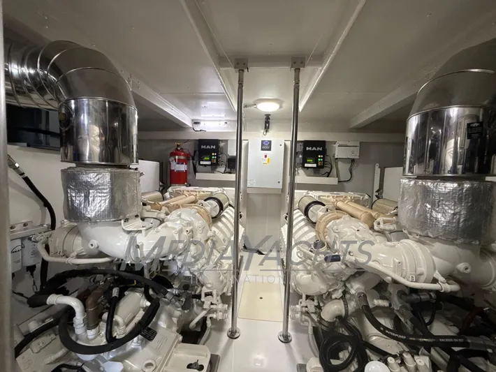  Yacht Photos Pics Engine room of 2019 Azimut Fly 72 yacht with MAN engines and fire safety equipment.