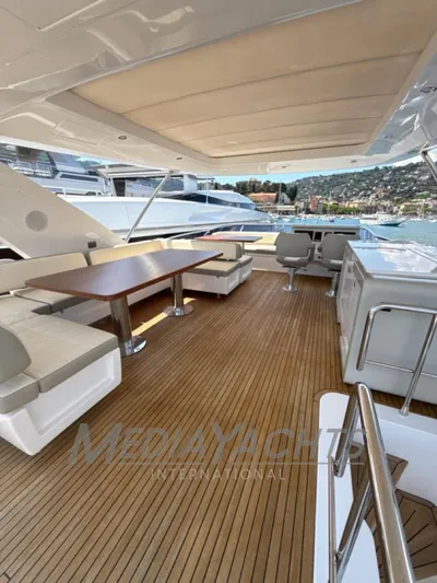  Yacht Photos Pics Luxurious 2019 Azimut Fly 72 yacht deck with seating and dining area.