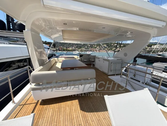  Yacht Photos Pics Luxurious 2019 Azimut Fly 72 yacht deck with elegant seating and scenic marina view.